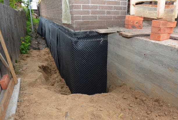 SJ Waterproofing Pros technician performing targeted Basement Waterproofing assessment in Churchville, PA